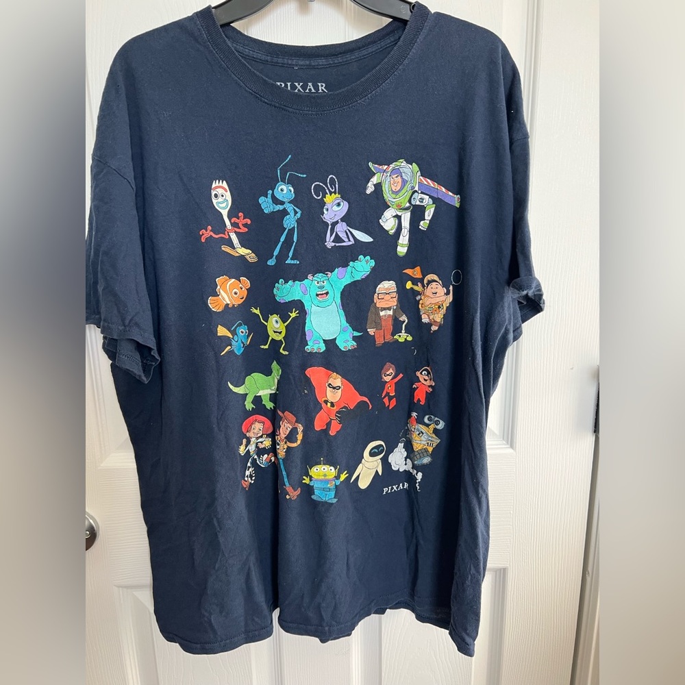 Size XL PIXAR navy blue short sleeve Tshirt.  Showcasing the Pixar characters.